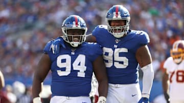 EAST RUTHERFORD, NEW JERSEY - SEPTEMBER 29: Dalvin Tomlinson #94 and B.J. Hill #95 of the New York Giants celebrates a sack of Dwayne Haskins #7 of the Washington Redskins during their game at MetLife Stadium on September 29, 2019 in East Rutherford, New Jersey. (Photo by Al Bello/Getty Images)