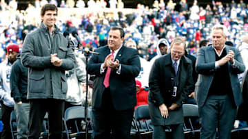 EAST RUTHERFORD, NJ - FEBRUARY 07: (L-R) Eli Manning #10 of the New York Giants speaks to fans as New Jersey Governor Chris Christie and New York Giants team owners John Mara and Laurence Tisch look on at a rally to celebrate the New York Giants' Super Bowl victory at MetLife Stadium on February 7, 2012 in East Rutherford, New Jersey. The Giants defeated the New England Patriots 21-17 in Super Bowl XLVI at Lucas Oil Stadium on February 5, 2012 in Indianapolis, Indiana. (Photo by Jeff Zelevansky/Getty Images)