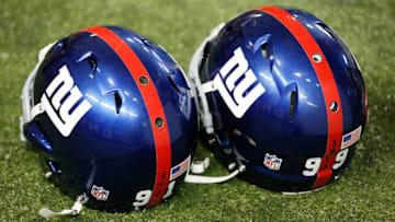 ATLANTA, GA - DECEMBER 16: The helmets of Justin Tuck #91 and Chris Canty #99 of the New York Giants sit on the turf with the initials S.H.E.S in honor of the shooting victims at Sandy Hook Elementary School in Connecticut prior to the game against the Atlanta Falcons at Georgia Dome on December 16, 2012 in Atlanta, Georgia. (Photo by Kevin C. Cox/Getty Images)