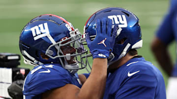 EAST RUTHERFORD, NEW JERSEY - JANUARY 03: Sterling Shepard #87 of the New York Giants is congratulated by Daniel Jones #8 after scoring on a 23-yard rushing touchdown against the Dallas Cowboys during the first quarter at MetLife Stadium on January 03, 2021 in East Rutherford, New Jersey. (Photo by Elsa/Getty Images)