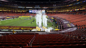 LANDOVER, MARYLAND - JANUARY 09: Washington Football Team players run onto the field prior to the game against the Tampa Bay Buccaneers at FedExField on January 09, 2021 in Landover, Maryland. (Photo by Rob Carr/Getty Images)