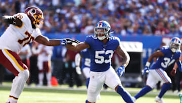 EAST RUTHERFORD, NEW JERSEY - SEPTEMBER 29: Oshane Ximines #53 of the New York Giants rushes against Morgan Moses #76 of the Washington Redskins during their game at MetLife Stadium on September 29, 2019 in East Rutherford, New Jersey. (Photo by Al Bello/Getty Images)