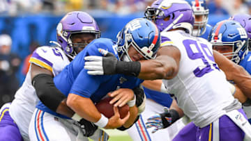 New York Giants quarterback Daniel Jones (8) is sacked by Minnesota Vikings defensive ends Ifeadi Odenigbo (Mandatory Credit: Robert Deutsch-USA TODAY Sports)