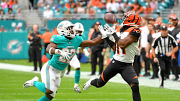 Dec 22, 2019; Miami Gardens, Florida, USA; Cincinnati Bengals wide receiver John Ross (11) hauls in a catch in front of Miami Dolphins defensive back Tae Hayes (22) during the first half at Hard Rock Stadium. Mandatory Credit: Steve Mitchell-USA TODAY Sports