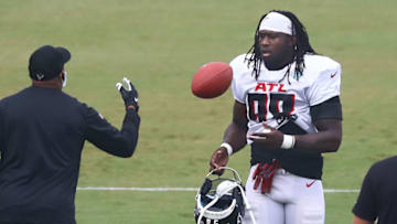 Aug 22, 2020; Flowery Branch, Georgia, USA; Atlanta Falcons defensive end Takk McKinley takes the field and a football for training camp at the Falcons training facility. Mandatory Credit: Curtis Compton/Pool Photo-USA TODAY Sports