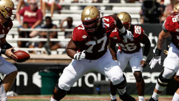 Sep 4, 2021; Chestnut Hill, Massachusetts, USA; Boston College Eagles offensive lineman Zion Johnson (77) looks to block against the Colgate Raiders during the first half at Alumni Stadium. Mandatory Credit: Winslow Townson-USA TODAY Sports