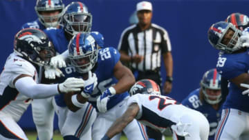 Saquon Barkley of the Giants runs the ball in the first half as the Denver Broncos came to MetLife Stadium in East Rutherford, NJ to play the New York Giants in the first game of the 2021 season on September 12, 2021.The Denver Broncos Came To Metlife Stadium In East Rutherford Nj To Play The New York Giants In The First Game Of The 2021 Season On September 12 2021