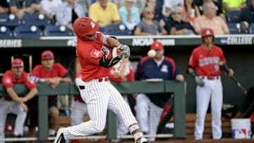 Jun 28, 2016; Omaha, NE, USA; Arizona Wildcats right fielder Zach Gibbons (23) hits a single during the first inning against the Coastal Carolina Chanticleers in game two of the College World Series championship series at TD Ameritrade Park. Mandatory Credit: Steven Branscombe-USA TODAY Sports