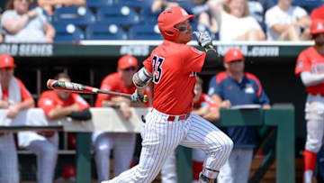 Jun 25, 2016; Omaha, NE, USA; Arizona Wildcats outfielder Zach Gibbons (23) drives in a run with a double in the second inning against the Oklahoma State Cowboys in the 2016 College World Series at TD Ameritrade Park. Mandatory Credit: Steven Branscombe-USA TODAY Sports