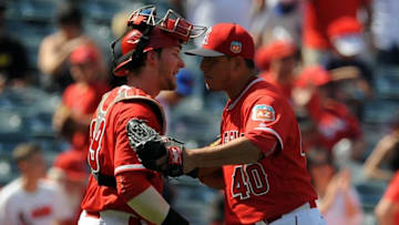 April 3, 2016; Anaheim, CA, USA; Los Angeles Angels catcher Taylor Ward (99) and pitcher Javy Guerra celebrate the 6-4 victory against Chicago Cubs at Angel Stadium of Anaheim. Mandatory Credit: Gary A. Vasquez-USA TODAY Sports