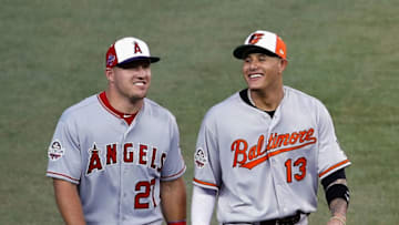 WASHINGTON, DC - JULY 17: Mike Trout #27 of the Los Angeles Angels of Anaheim and the American League and Manny Machado #13 of the Baltimore Orioles and the American League walk on the field during the 89th MLB All-Star Game, presented by Mastercard at Nationals Park on July 17, 2018 in Washington, DC. (Photo by Patrick McDermott/Getty Images)