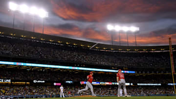 LOS ANGELES, CALIFORNIA - JULY 24: Kole Calhoun #56 of the Los Angeles Angels celebrates his solo homerun off of Ross Stripling #68 of the Los Angeles Dodgers, for a 2-0 lead, during the fourth inning at Dodger Stadium on July 24, 2019 in Los Angeles, California. (Photo by Harry How/Getty Images)