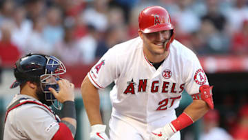 ANAHEIM, CALIFORNIA - AUGUST 31: Mike Trout #27 of the Los Angeles Angels of Anaheim talks with Sandy Leon #3 of the Boston Red Sox during an at bat of a game at Angel Stadium of Anaheim on August 31, 2019 in Anaheim, California. (Photo by Sean M. Haffey/Getty Images)