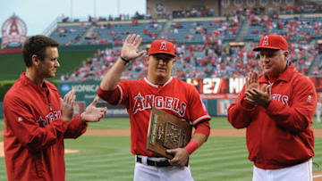 ANAHEIM, CA - APRIL 13: Mike Trout #27 (C) of the Los Angeles Angels of Anaheim is presented with the Jackie Robinson Rookie of the Year Award before the game against the Houston Astros at Angel Stadium of Anaheim on April 13, 2013 in Anaheim, California. (Photo by Lisa Blumenfeld/Getty Images)