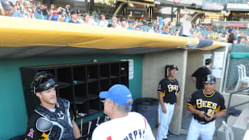 SALT LAKE CITY, UT - JULY 08: Salt Lake Bees catcher John Hester talks with baseball legend Dale Murphy during a stop of the 2014 Mobil Super "Go The Distance" Baseball Tour on July 8, 2014 in Salt Lake City, Utah. (Photo by Fred Hayes/Getty Images for Mobil Super)