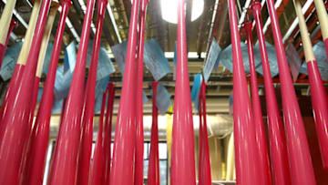 LOUISVILLE, KY - MAY 06: Pink bats dry at the Louisville Slugger Museum and Factory on May 6, 2014 in Louisville, Kentucky. Major League Players will use pink bats on Mothers Day as part of the MLB Going to Bat Against Breat Cancer program which is in its 9the year (Photo by Andy Lyons/Getty Images)