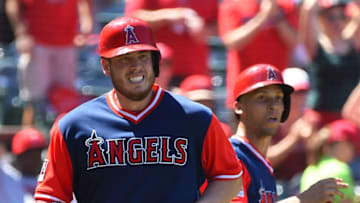 ANAHEIM, CA - AUGUST 27: C.J. Cron #24 and Andrelton Simmons #2 of the Los Angeles Angels of Anaheim both score on a triple by Ben Revere #25 of the Los Angeles Angels of Anaheim in the fifth inning of the game against the Houston Astros at Angel Stadium of Anaheim on August 27, 2017 in Anaheim, California. (Photo by Jayne Kamin-Oncea/Getty Images)