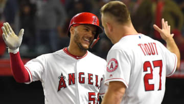ANAHEIM, CA - SEPTEMBER 24: Michael Hermosillo #59 is congratulated by Mike Trout #27 of the Los Angeles Angels of Anaheim of Anaheim is congratulated in the dugout after hitting a one run home in the fifth inning of the game against the Texas Rangers at Angel Stadium on September 24, 2018 in Anaheim, California. (Photo by Jayne Kamin-Oncea/Getty Images)