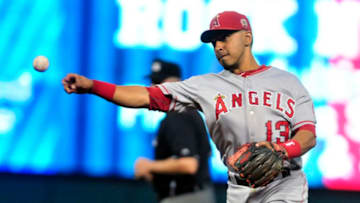 CLEVELAND, OH - JULY 25: Maicer Izturis #13 of the Los Angeles Angels throws to first after fielding a ground ball during the fifth inning against the Cleveland Indians at Progressive Field on July 25, 2011 in Cleveland, Ohio. (Photo by Jason Miller/Getty Images)