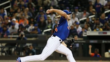 Sep 28, 2021; New York City, New York, USA; New York Mets starting pitcher Noah Syndergaard (34) throws against the Miami Marlins during the first inning of game two of a doubleheader at Citi Field. Mandatory Credit: Andy Marlin-USA TODAY Sports