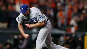 Oct 14, 2021; San Francisco, California, USA; Los Angeles Dodgers pitcher Max Scherzer (31) celebrates recording the final out against the San Francisco Giants in the ninth inning during game five of the 2021 NLDS at Oracle Park. Mandatory Credit: D. Ross Cameron-USA TODAY Sports