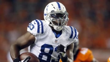 Sep 7, 2014; Denver, CO, USA; Indianapolis Colts tight end Dwayne Allen (83) catches a pass for a touchdown during the second half against the Denver Broncos at Sports Authority Field at Mile High. The Broncos won 31-24. Mandatory Credit: Chris Humphreys-USA TODAY Sports