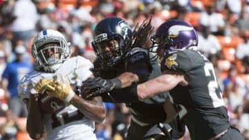 January 31, 2016; Honolulu, HI, USA; Team Rice wide receiver T.Y. Hilton of the Indianapolis Colts (13, left) fails to catch a pass against Team Irvin cornerback Richard Sherman of the Seattle Seahawks (25) and Team Irvin free safety Harrison Smith of the Minnesota Vikings (22) during the second quarter of the 2016 Pro Bowl game at Aloha Stadium. Mandatory Credit: Kyle Terada-USA TODAY Sports