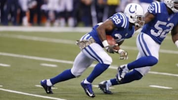 Nov 8, 2015; Indianapolis, IN, USA; Indianapolis Colts safety Mike Adams (29) makes an interception and injures his leg on the return during a game against the Denver Broncos at Lucas Oil Stadium. Mandatory Credit: Brian Spurlock-USA TODAY Sports