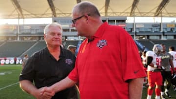 January 17, 2015; Carson, CA, USA; National head coach Mike Martz meets with American head coach following the NFLPA Collegiate Bowl at StubHub Center. Mandatory Credit: Gary A. Vasquez-USA TODAY Sports