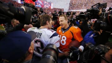 Jan 24, 2016; Denver, CO, USA; Denver Broncos quarterback Peyton Manning (18) greets New England Patriots quarterback Tom Brady (12) after the AFC Championship football game at Sports Authority Field at Mile High. Mandatory Credit: Kevin Jairaj-USA TODAY Sports