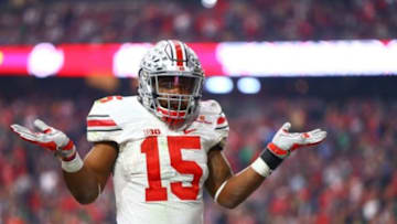 Jan 1, 2016; Glendale, AZ, USA; Ohio State Buckeyes running back Ezekiel Elliott (15) reacts in the end zone as he celebrates a second half against the Notre Dame Fighting Irish during the 2016 Fiesta Bowl at University of Phoenix Stadium. The Buckeyes defeated the Fighting Irish 44-28. Mandatory Credit: Mark J. Rebilas-USA TODAY Sports