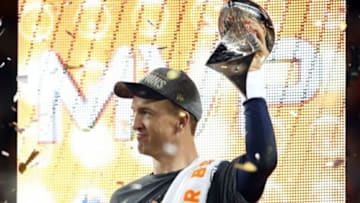Feb 7, 2016; Santa Clara, CA, USA; Denver Broncos quarterback Peyton Manning (18) celebrates with the Vince Lombardi Trophy after beating the Carolina Panthers in Super Bowl 50 at Levi