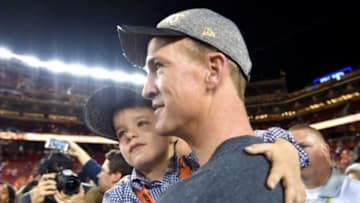 Feb 7, 2016; Santa Clara, CA, USA; Denver Broncos quarterback Peyton Manning leaves the stadium after the game with his son Marshall Manning after the game against the Carolina Panthers in Super Bowl 50 at Levi