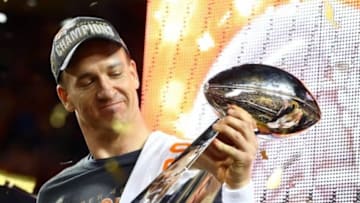 Feb 7, 2016; Santa Clara, CA, USA; Denver Broncos quarterback Peyton Manning (18) hoists the Vince Lombardi Trophy after defeating the Carolina Panthers in Super Bowl 50 at Levi