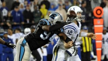 Nov 2, 2015; Charlotte, NC, USA; Carolina Panthers defensive end Kony Ealy (94) forces a fumble from Indianapolis Colts quarterback Andrew Luck (12) during the first half of the game at Bank of America Stadium. Mandatory Credit: Sam Sharpe-USA TODAY Sports