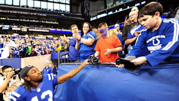 Nov 29, 2015; Indianapolis, IN, USA;Indianapolis Colts receiver T.Y. Hilton (13) throws a fan one of his gloves after their game against the Tampa Bay Buccaneers at Lucas Oil Stadium. The Indianapolis Colts won over the Tampa Bay Buccaneers, 25-12. Mandatory Credit: Thomas J. Russo-USA TODAY Sports
