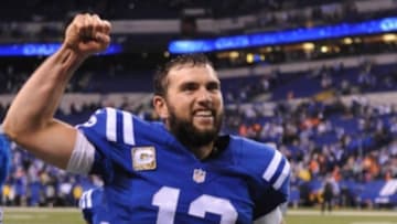 Nov 8, 2015; Indianapolis, IN, USA; Indianapolis Colts quarterback Andrew Luck (12) raises his arm as he leaves the field moments after the Colts defeated the Broncos, 27-24 at Lucas Oil Stadium. Mandatory Credit: Thomas J. Russo-USA TODAY Sports