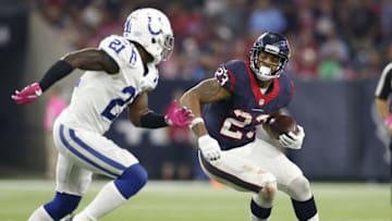 Oct 8, 2015; Houston, TX, USA; Houston Texans running back Arian Foster (23) runs with the ball against Indianapolis Colts cornerback Vontae Davis (21) at NRG Stadium. The Colts beat the Texans 27-20. Mandatory Credit: Matthew Emmons-USA TODAY Sports