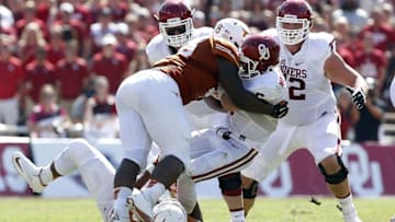 Oct 10, 2015; Dallas, TX, USA; Texas Longhorns defensive tackle Hassan Ridgeway (98) and defensive tackle Paul Boyette Jr. (93) sack Oklahoma Sooners quarterback Baker Mayfield (6) in the second quarter during the Red River rivalry at Cotton Bowl Stadium. Mandatory Credit: Tim Heitman-USA TODAY Sports