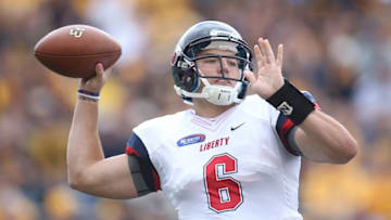 Sep 12, 2015; Morgantown, WV, USA; Liberty Flames quarterback Josh Woodrum (6) passes the ball against the West Virginia Mountaineers during the first quarter at Milan Puskar Stadium. Mandatory Credit: Charles LeClaire-USA TODAY Sports