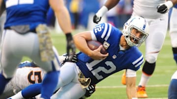Nov 8, 2015; Indianapolis, IN, USA; Indianapolis Colts quarterback Andrew Luck (12) raises his arm as he leaves the field moments after the Colts defeated the Broncos, 27-24 at Lucas Oil Stadium. Mandatory Credit: Thomas J. Russo-USA TODAY Sports