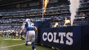 Oct 25, 2015; Indianapolis, IN, USA; Indianapolis Colts quarterback Andrew Luck (12) runs onto the field during player introductions prior to the game against the New Orleans Saints at Lucas Oil Stadium. Mandatory Credit: Brian Spurlock-USA TODAY Sports