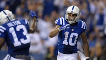 Sep 21, 2015; Indianapolis, IN, USA; Indianapolis Colts receiver Donte Moncrief (10) celebrates with receiver T.Y.Hilton (13) after scoring on a 26-yard touchdown pass in the fourth quarter during an NFL football game against the New York Jets at Lucas Oil Stadium. Mandatory Credit: Kirby Lee-USA TODAY Sports