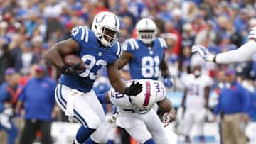 Sep 13, 2015; Orchard Park, NY, USA; Indianapolis Colts tight end Dwayne Allen (83) runs after a catch and is tackled by Buffalo Bills strong safety Bacarri Rambo (30) during the first quarter at Ralph Wilson Stadium. Mandatory Credit: Kevin Hoffman-USA TODAY Sports