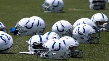 Jun 7, 2016; Indianapolis, IN, USA; Indianapolis Colts lay their helmets on the field as they stretch during mini camp at the Indiana Farm Bureau Center. Mandatory Credit: Brian Spurlock-USA TODAY Sports