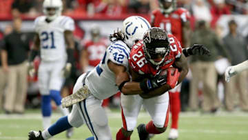 Nov 22, 2015; Atlanta, GA, USA; Atlanta Falcons running back Tevin Coleman (26) is tackled by Indianapolis Colts strong safety Clayton Geathers (42) after a run in the first quarter of their game at the Georgia Dome. The Colts won 24-21. Mandatory Credit: Jason Getz-USA TODAY Sports