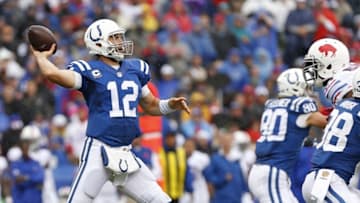 Sep 13, 2015; Orchard Park, NY, USA; Indianapolis Colts quarterback Andrew Luck (12) throws a pass under pressure by Buffalo Bills defensive end Mario Williams (94) during the second half at Ralph Wilson Stadium. Bills beat the Colts 27-14. Mandatory Credit: Kevin Hoffman-USA TODAY Sports