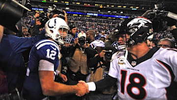 Nov 8, 2015; Indianapolis, IN, USA; Indianapolis Colts quarterback Andrew Luck (12) shakes hands with Denver Broncos quarterback Peyton Manning (18) moments after Indianapolis defeated the Broncos , 27-24 at Lucas Oil Stadium. Mandatory Credit: Thomas J. Russo-USA TODAY Sports