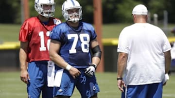 Jul 27, 2016; Anderson, IN, USA; Indianapolis Colts quarterback Andrew Luck (12) works with center Ryan Kelly (78) and Joe Gilbert, assistant offensive line coach during training camp at Anderson University. Mandatory Credit: Matt Kryger/Indianapolis Star via USA TODAY Sports