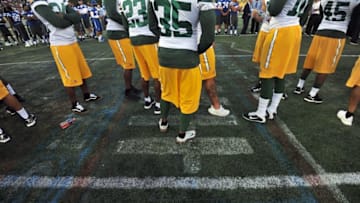 Aug 7, 2016; Canton, OH, USA; Green Bay Packers players stand on the center logo, which was deemed unsafe for play at the 2016 Hall of Fame Game at Tom Benson Hall of Fame Stadium. Mandatory Credit: Ken Blaze-USA TODAY Sports